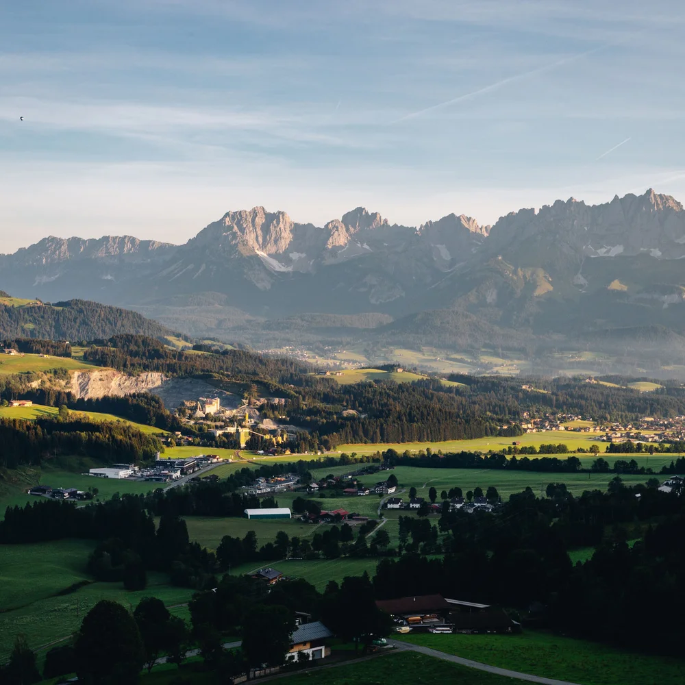 Blog Landscape with mountains and villages in the valley at soft evening light
