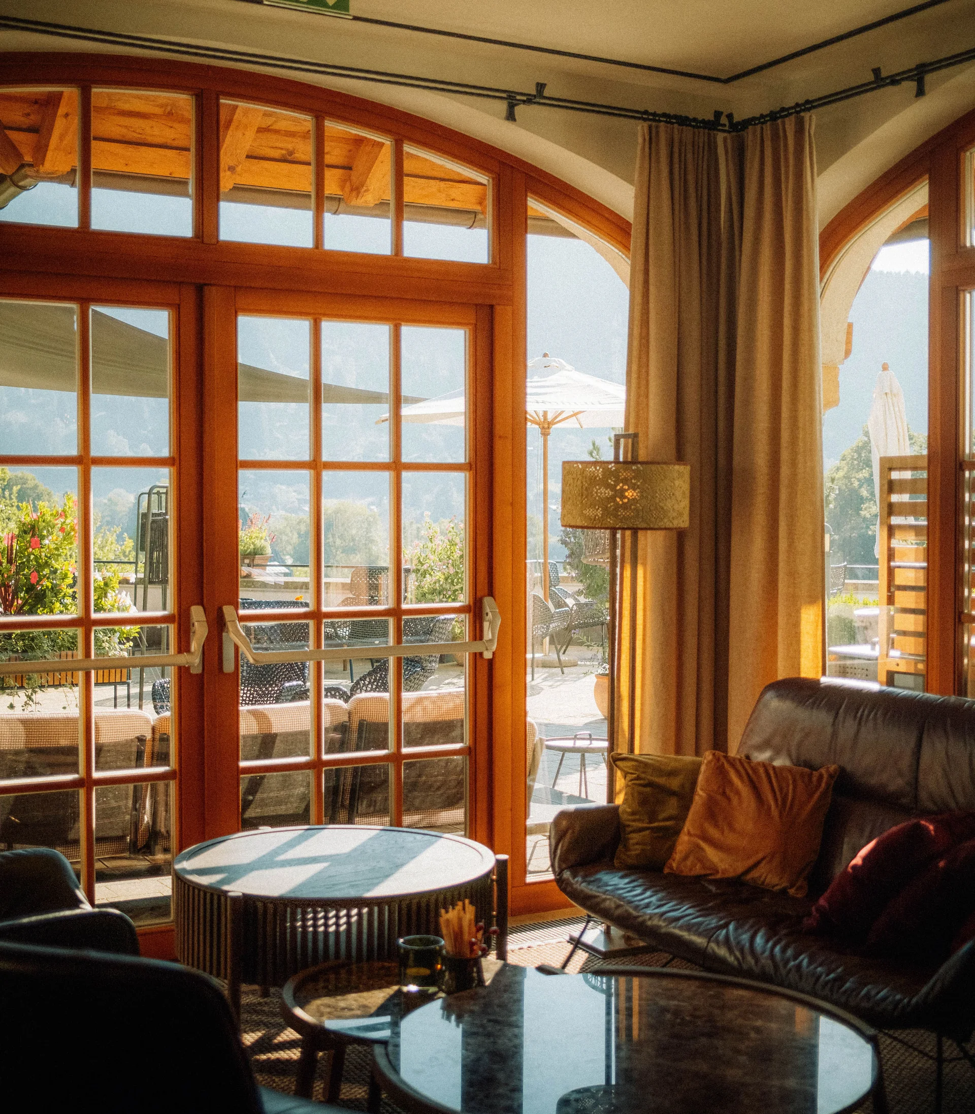 Blog Cozy interior with sofa and glass doors opening to sunny outdoor area