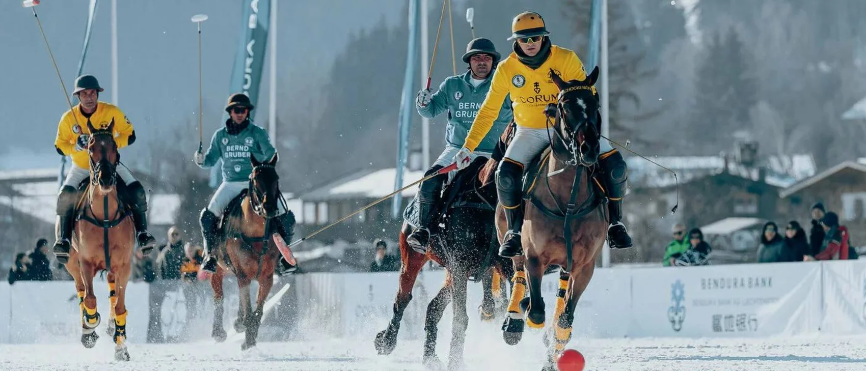 24th Bendura Bank Snow PoloWorld Cup Kitzbühel Polo players on horseback playing on a snowy field